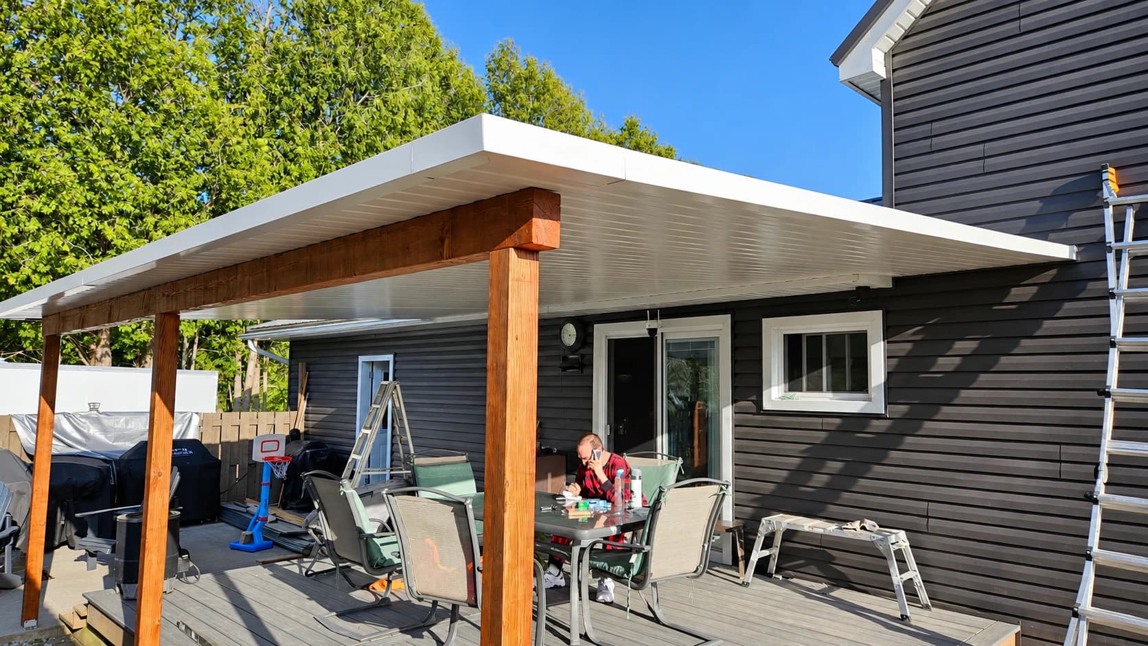Covered outdoor structure with a finished insulated roof