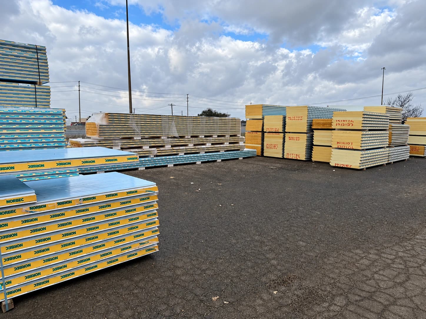Insulated panels staged in a supply yard or prepared for transport