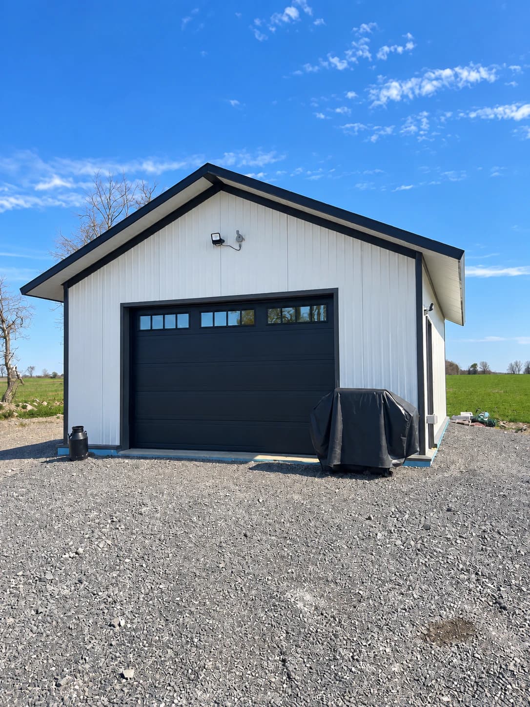 Insulated-panel garage building in an open yard